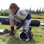 Foma Reutov, a freshman, ties up his shoes before a Cougars football practice Friday, Sept. 1, 2017 at McNeil Canyon Elementary in Fritz Creek, Alaska. The team, usually made up of a mix of students from the Russian Old Believer Villages Voznesenka, Razdolna and Kachemak-Selo, is in its fifth year as a varsity, 11-man program. (Photo by Megan Pacer/Homer News)
