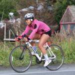 Homer Mariners swimmer Alia Bales bikes down onto the Homer Spit during the second leg of the Homer Mariner Triathlon on Saturday, Sept. 2, 2017 in Homer, Alaska. She tied for fourth in her age group with another member of the swim team, Adeline Berry. (Photo by Megan Pacer/Homer News)