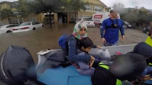 Former Anchor Point resident Chase McKinney, in blue shirt, helps rescue Houston-area flood survivors Aug. 28-30, 2017 in Texas. McKinney and a friend, Israel Lopez, picked up stranded victims and helped get them to high ground in their bass boat. (Photo provided)