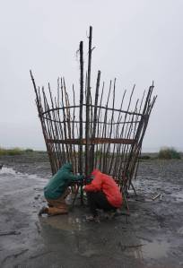 Robin Austin, left, and Natalia Mulawa, right, work on Shine, this year&rsquo;s Burning Basket, Tuesday, Sept. 5, 2017 at Mariner Park on the Homer Spit, Alaska. The annual interactive art project will be offered to the community on Sunday and then transformed into heat and light at sunset. (Photo by Michael Armstrong, Homer News)
