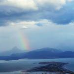 A rainbow appears over Kachemak Bay and Poot Peak on Monday, Sept. 4, 2017 in Homer, Alaska. (Photo by Michael Armstrong/Homer News)