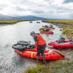 Lael Wilcox prepares to launch her loaded packraft into the Fox River. (Photo by Bjørn Olson)