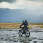 Daniel Countiss attempts to stay upright on his fat-bike while riding in slippery mud at the head of Kachemak Bay. (Photo by Bjørn Olson)