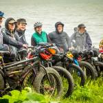 Jessi Dullinger, Margaret Drummer, Daniel Countiss, Lael Wilcox, Bjørn Olson, Kim McNett, and Derek Reynolds stand for a group photo before heading out on their three-day fat-bike and packraft trip around Kachemak Bay. (Photo by Bjørn Olson)