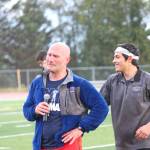 Homer High School Athletic Director Chris Perk gets emotional as his wife, Homer teacher Saundra Hudson, nears the finish line of a mile run during the Mariner Mile fundraising event Thursday, Sept. 14, 2017 at the track in Homer, Alaska. Hudson, an active member of the Homer running community who championed for the high school track to be put in, received a head injury after she slipped on ice while running in March. Thursday&rsquo;s mile was the first time she&rsquo;s run since the injury six months ago. (Photo by Homer News/Megan Pacer)