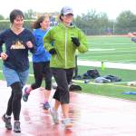 Kathy Beachy (left) runs around the Homer High School track with Saundra Hudson, an active member and cultivator of the running community and a teacher at the high school, during the Mariner Mile on Thursday, Sept. 14, 2017 in Homer, Alaska. Hudson got a concussion this past March when she slipped on the ice while running, and the mile she ran in the fundraising event for the Kachemak Bay Running Club was the her first return to running in six months. (Photo by Megan Pacer/Homer News)