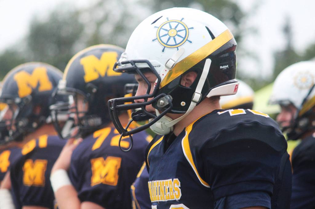 Members of the Homer Mariners varsity football team watch their teammates from the sidelines during their homecoming game against Nikiski High School on Saturday, Sept. 16, 2017 at the high school in Homer, Alaska. The Mariners were victorious 38-0. (Photo by Megan Pacer/Homer News)