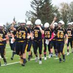 Players on the Homer Mariners varsity football team leave the field celebrating after their win against Nikiski High School in a homecoming game Saturday, Sept. 16, 2017 at Homer High School in Homer, Alaska. The Mariners topped the Bulldogs 38-0. (Photo by Megan Pacer/Homer News)