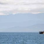 The Japanese Self Defense Force ship Kashima, DD-3508, left, passes by its sister ship, Harusame, DD-102, as they prepare to anchor off the Homer Spit on Monday morning. A training cruise for newly commissioned officers, the ships arrived in Homer on their way to a visit in Anchorage. (Photo by Michael Armstrong, Homer News)