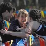 Homer freshman Autumn Daigle celebrates her victory in the Division II girls race with her mom, Anne, and brother, Ben, at the ASAA/First National Bank Alaska State Cross Country Championships on Saturday, Sept. 30, 2017 at Bartlett High School in Anchorage, Alaska. (Photo by Matt Tunseth/Chugiak-Eagle River Star)
