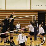 A horde of Seward High School varsity volleyball players block a hit from sophomore Marina Carroll during the Homer Mariners&rsquo; home game against the Seahawks on Friday, Sept. 29, 2017 at the Alice Witte Gymnasium in Homer, Alaska. The Mariners fell to the Seahawks, winning one set to the Seahawks&rsquo; three sets. (Photo by Megan Pacer/Homer News)