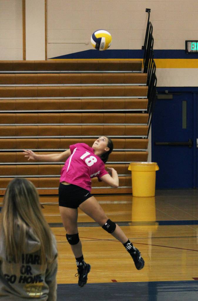 Senior Raisa Basargin serves the ball during the Homer Mariner varsity volleyball team&rsquo;s game against Anchorage Christian School on Saturday, Sept. 30, 2017 in the Alice Witte Gymnasium in Homer, Alaska. The Mariners fell to ACS three sets to zero. (Photo by Megan Pacer/Homer News)