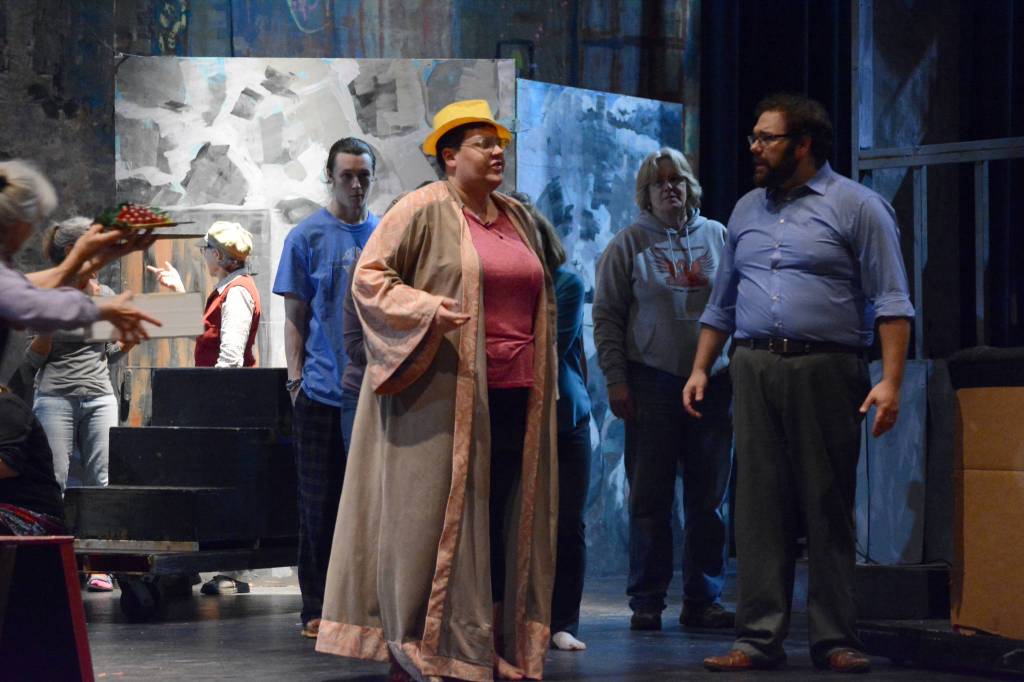 Carolyn Norton, center, as King Herod, performs &ldquo;King Herod&rsquo;s Song&rdquo; as Kyle Schneirder, right, as Jesus, watches during rehearsals last Friday, Sept. 29 for &ldquo;Jesus Christ Superstar.&rdquo; The musical opens 7:30 p.m. Oct. 6 at the Mariner Theatre in Homer, Alaska. (Photo by Michael Armstrong, Homer News)