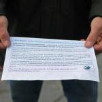 Toby Monroe of Soldotna holds out the paper he received after voting explaining why he was not able to vote on Kenai Peninsula Borough Proposition 1 on Tuesday in Soldotna. Proposition 1 asks voters outside the incorporated cities whether commercial cannabis operations should be legal in the borough outside the cities, but only voters registered outside city limits could vote on it. Soldotna residents on Tuesday voted on two city council members and a mayor, all unopposed candidates, on one of three candidates for Kenai Peninsula Borough mayor and on two of the three borough propositions. (Photo by Elizabeth Earl/Peninsula Clarion)