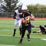 Senior Jack Heimbold runs the ball during the Homer varsity football team&rsquo;s Saturday, Oct. 7, 2017 game against Ben Eielson High School in Homer, Alaska. The Mariners topped the Ravens 33-21 and will head to the ASAA First National Bowl Series Division III Championship. (Photo by Megan Pacer/Homer News)