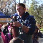 Tim Blackman with the Alaska Department of Fish and Game shows students from lower Kenai Peninsula schools the different parts of a coho salmon&rsquo;s anatomy during an egg take event Thursday, Oct. 5, 2017 at the Anchor River in Anchor Point, Alaska. The egg take is the first event that kicks off the year-long Salmon in the Classroom program, in which students learn about the salmon life cycle while taking care of salmon fry. (Photo by Megan Pacer/Homer News)