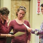 Caroline Venuti (left) and Rachel Lord (center) are sworn in as Homer City Council members by City Clerk Melissa Jacobsen (right) on Monday, Oct. 9, 2017 at the Cowles Council Chambers in Homer, Alaska. (Photo by Megan Pacer/Homer News)