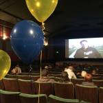 Homer residents watch a livestream of the ASAA First National Bowl Series Division III Football State Championship game in Palmer on Saturday, Oct. 14, 2017 at the Homer Theatre. The Mariners lost to Barrow High School 20-14. (Photo by Megan Pacer/Homer News)