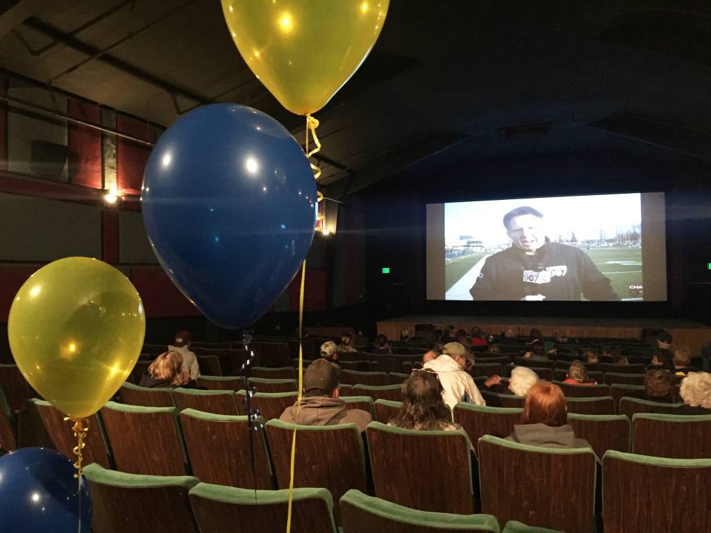 Homer residents watch a livestream of the ASAA First National Bowl Series Division III Football State Championship game in Palmer on Saturday, Oct. 14, 2017 at the Homer Theatre. The Mariners lost to Barrow High School 20-14. (Photo by Megan Pacer/Homer News)