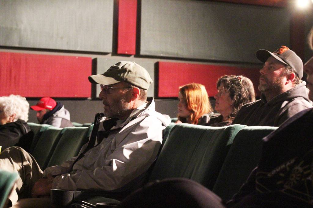 Homer residents watch with rapt attention the varsity football team&rsquo;s state championship game against Barrow High School on Saturday, Oct. 14, 2017 at the Homer Theatre, where it was livestreamed for those who weren&rsquo;t able to travel to the game&rsquo;s location in Barrow. The Mariners fell short at the ASAA First National Bowl Series Division III Football State Championship game, 20-14. (Photo by Megan Pacer/Homer News)