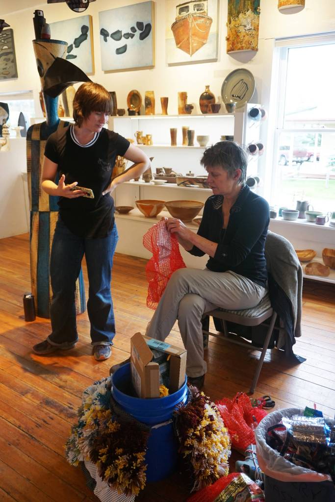 Sheila Wyne, right, helps Mallory Drover with a Wearable Arts piece Saturday, Oct. 14, 2017 at a workshop Wyne held at the Bunnell Street Arts Center in Homer, Alaska. Wyne is artist in residence at Bunnell is a residency sponsored by the Homer Fiber Arts Collective. (Photo by Michael Armstrong)