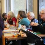 Marie Anderson Walker (right) speaks to a member of the audience following a panel called Women Pioneers Speak on Saturday, Oct. 14, 2017 at the Homer Senior Citizens Center in Homer, Alaska. Four women whose families homesteaded in Alaska told tales of the early days to a crowd eager for stories. (Photo by Megan Pacer/Homer News)