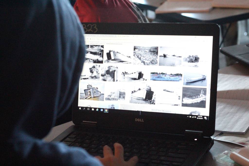 A student uses the Internet to research naval ships during a special lesson taught by retired McNeil Canyon teacher Bill Noomah on Thursday, Oct. 19, 2017 to a fifth grade class at West Homer Elementary School in Homer, Alaska. Noomah created the investigation lesson as a way to teach students about Veterans Day and how to primary sources based on a collection from the Library of Congress. (Photo by Megan Pacer/Homer News)