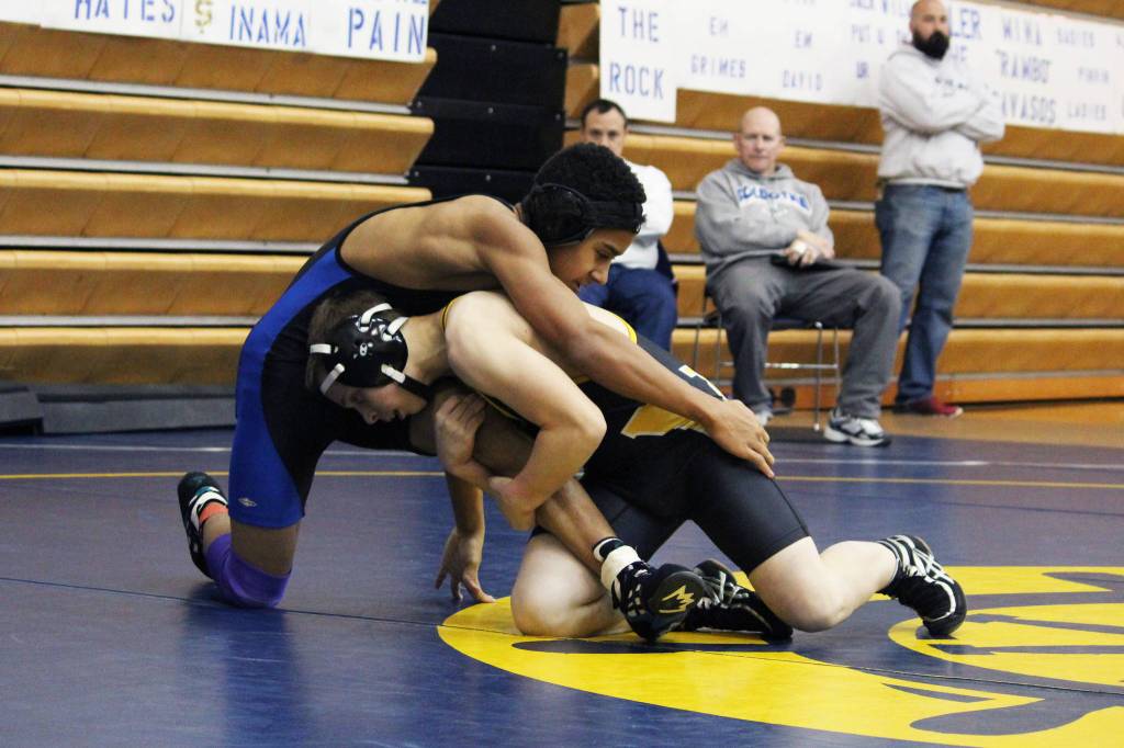 Voznesenka&rsquo;s Maxim Kusnetsov works on Soldotna&rsquo;s Ben Booth during the Round Robin Rumble Tournament on Saturday, Oct. 21, 2017 at Homer High School in Homer, Alaska. (Photo by Megan Pacer/Homer News)