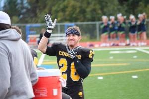 Voznesnka senior David Sanarov waves to the crowd during a senior night ceremony before the team&rsquo;s Sept. 15, 2017 game at the Homer High School football field in Homer, Alaska. (Photo by Megan Pacer/Homer News)