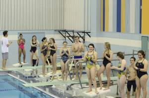 The members of the Homer Mariners swim and dive team celebrate at a send-off event held Tuesday, Oct. 24, 2017 at the Kate Kuhns Aquatic Center in Homer, Alaska, in preparation for competing at the regional level in Palmer. (Photo by Megan Pacer/Homer News)