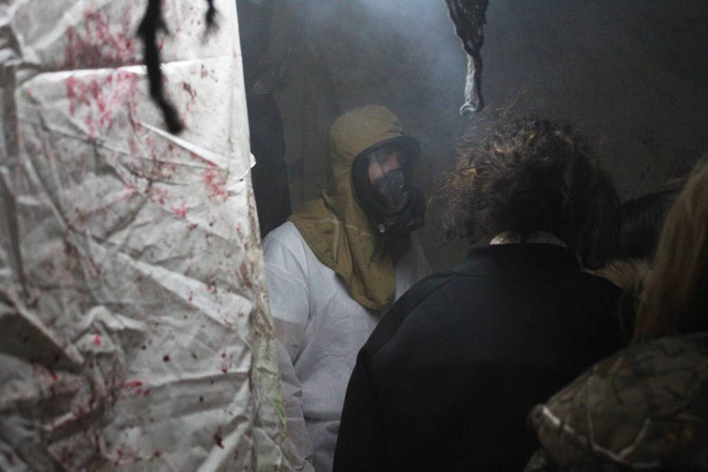 A group of young girls make their way cautiously through the U.S. Coast Guard Cutter Hickory during the annual Haunted Hickory event Thursday, Oct. 26, 2017 in Homer, Alaska. Hundreds of residents young and old line up to have the living daylights scared out of them by the Hickory crew and their families, who spend nearly two full days decking out the ship. (Photo by Megan Pacer/Homer News)