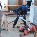 Tyler Partin pretends to eviscerate fellow crew member Ben Bergeron during this year&rsquo;s Haunted Hickory aboard the U.S. Coast Guard Cutter Hickory on Thursday, Oct. 26, 2017 in Homer, Alaska. Hundreds of residents young and old line up to have the living daylights scared out of them by the Hickory crew and their families, who spend nearly two full days decking out the ship. (Photo by Megan Pacer/Homer News)