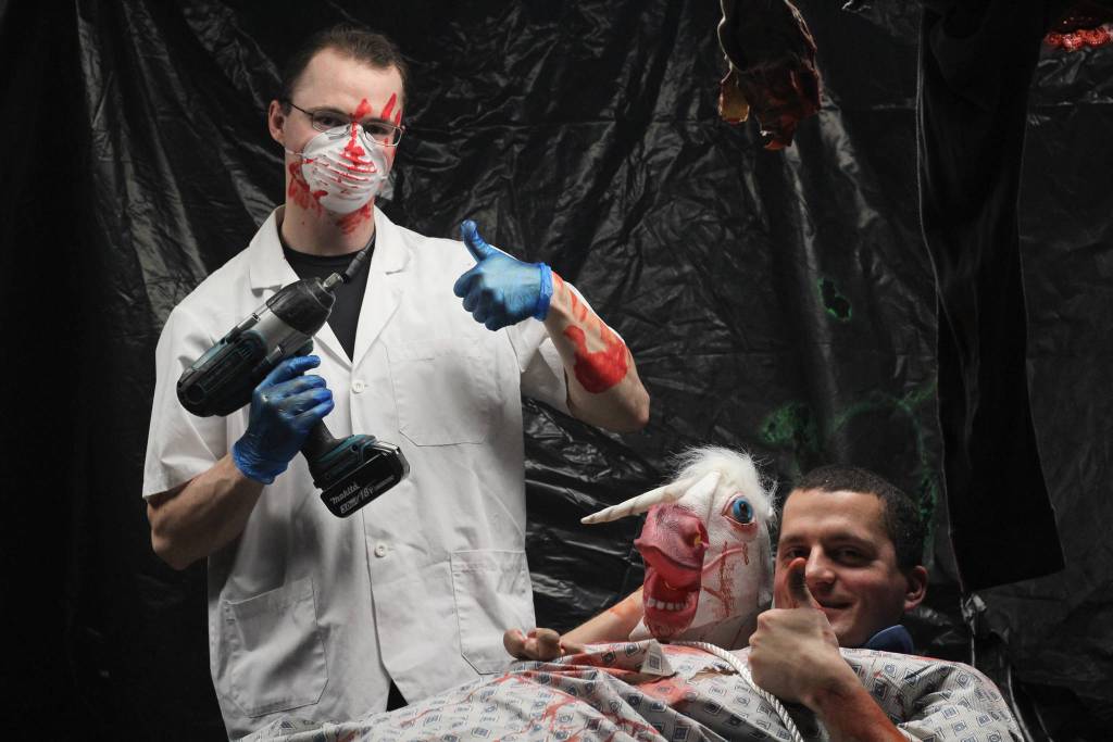 Bryan Palmer (left) and Matthew Koran (right) prepare to scare the living daylights out of some kids during this year&rsquo;s Haunted Hickory event aboard the U.S. Coast Guard Cutter Hickory on Thursday, Oct. 26, 2017 in Homer, Alaska. Admission to the event is two nonperishable food items, and all the proceeds get donated to the Homer Food Pantry. (Photo by Megan Pacer/Homer News)