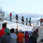 Fresh from being frightened, a group of people walks down off the U.S. Coast Guard Cutter Hickory while dozens more wait in line for this year&rsquo;s Haunted Hickory event Thursday, Oct. 26, 2017 in Homer, Alaska. Last year, about 1,000 people queued up at the Homer Spit to take a spooky tour of the ship, which the crew spends about two days transforming. (Photo by Megan Pacer/Homer News)