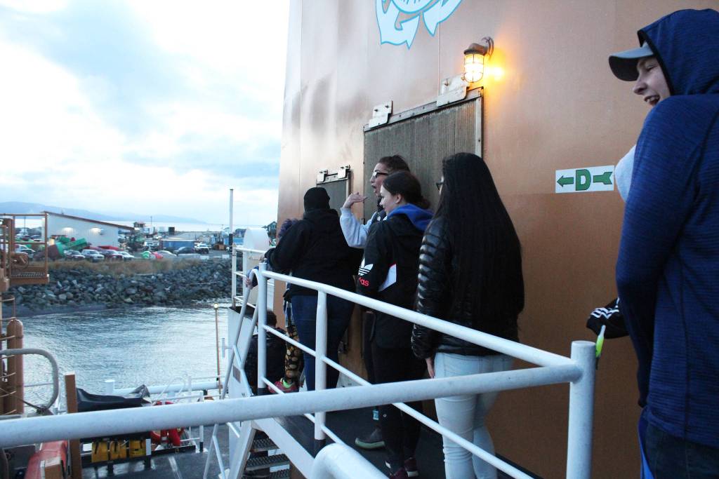 A group of young people make their way across the U.S. Coast Guard Cutter Hickory at the start of their spooky tour in this year&rsquo;s Haunted Hickory event Thursday, Oct. 26, 2017 in Homer, Alaska. They and hundreds of others donated two nonperishable items to get scared by the ship&rsquo;s crew members and their families during the annual event. (Photo by Megan Pacer/Homer News)