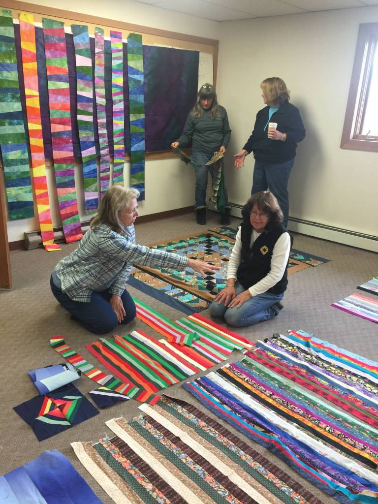 Members of the Kachemak Bay Quilters work on their quilts (Photo provided)