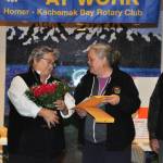 Sharon Minsch, left, accepts flowers from Beth Trowbridge, Homer Kachemak Bay Rotary Club President, at this year&rsquo;s Rotary Health Fair on Saturday, Oct. 28, 2017 at Homer High School in Homer, Alaska. (Photo submitted)