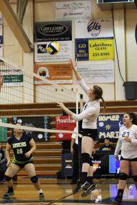 Sophomore Karmyn Gallios hits the ball over the net during the Homer varsity volleyball team&rsquo;s match against the Redington Huskies on Friday, Nov. 3, 2017 during the Southcentral Conference Championships held at the Alice Witte Gymnasium in Homer, Alaska. (Photo by Megan Pacer/Homer News)