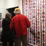 Passersby inspect the work of the Kachemak Bay Quilters during a First Friday exhibit Friday, Nov. 3, 2017 at the Homer Council on the Arts in Homer, Alaska. The quilting group has been around for more than 30 years. (Photo by Megan Pacer/Homer News)