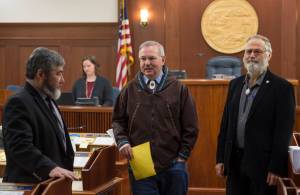 Speaker of the House Bryce Edgmon, D-Dillingham, center, leaves the House chambers with Rep. Sam Kito, D-Juneau, left, and Rep. Paul Seaton, R-Homer, after holding a short technical session at the Capitol on Monday, Nov. 13, 2017. The Alaska Senate on Friday approved a constitutionally problematic criminal justice reform bill, then adjourned the fourth special session of the 30th Alaska Legislature. (Michael Penn