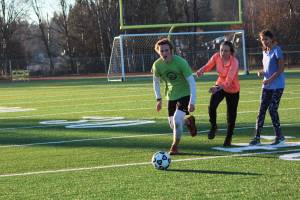 Members of the Homer High School Nordic ski team play a game during their Friday, Nov, 3, 2017 practice at the high school in Homer, Alaska. The team just recently started practicing on snow. (Photo by Megan Pacer/Homer News)