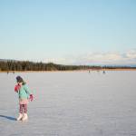 Pinky Sarber skates on Beluga Lake last Friday afternoon, Nov. 17, 2017 in Homer, Alaska. With clear and cold weather, the lake has frozen enough to support ice skating. A slight dusting of snow last Thursday didn&rsquo;t affect skating. (Photo by Michael Armstrong, Homer News)