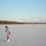 Pinky Sarber skates on Beluga Lake last Friday afternoon, Nov. 17, 2017 in Homer, Alaska. With clear and cold weather, the lake has frozen enough to support ice skating. A slight dusting of snow last Thursday didn&rsquo;t affect skating. (Photo by Michael Armstrong, Homer News)