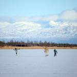 Skaters glide across Beluga Lake last Friday afternoon, Nov. 17, 2017 in Homer, Alaska. With clear and cold weather, the lake has frozen enough to support ice skating. A slight dusting of snow last Thursday didn&rsquo;t affect skating. (Photo by Michael Armstrong, Homer News)