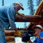 Tom Irons, left, and Jean Aspen, right, film in the summer of 2017 as part of their ongoing chronicle of life at their cabin, Kernwood, on the Chandalar River in the Brooks Range. (Photo provided by Jean Aspen and Tom Irons)