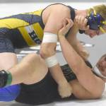 Homer&rsquo;s Levi King works his way to a pin of Colony&rsquo;s Simon Ganchenko at 195 pounds Saturday, Nov. 11, 2017, in the championship dual of the Peninsula Duals at Nikiski High School in Nikiski, Alaska. (Photo by Jeff Helminiak/Peninsula Clarion)