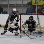 A member of the Homer High School hockey team takes a shot against Soldotna High School during the last game of the End of the Road Shootout on Saturday, Nov. 18, 2017 at the Kevin Bell Arena in Homer, Alaska. The Mariners toppled the Stars 10-3 and won the tournament. (Photo by Megan Pacer/Homer News)