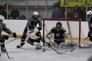 A member of the Homer High School hockey team takes a shot against Soldotna High School during the last game of the End of the Road Shootout on Saturday, Nov. 18, 2017 at the Kevin Bell Arena in Homer, Alaska. The Mariners toppled the Stars 10-3 and won the tournament. (Photo by Megan Pacer/Homer News)