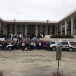 Sgt. Ryan Browning and Officer Jim Knott pose with teenagers at the State Youth Court Conference in summer 2015 in Anchorage, Alaska. The Homer Police Department has been invited to travel around the state to share its Project Drive, and anti-drunk driving educational clinic in place since 2011. (Photo courtesy Ryan Browning)
