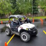 Homer PD&rsquo;s Sgt. Ryan Browning (right) talks to a teen driver while he traverses a course with Officer Jim Knott (left) at a Project Drive clinic they put on in Anchorage. The department has put hundreds of students through the anti-drunk driving educational clinic since it began in 2011. (Photo courtesy Ryan Browning)